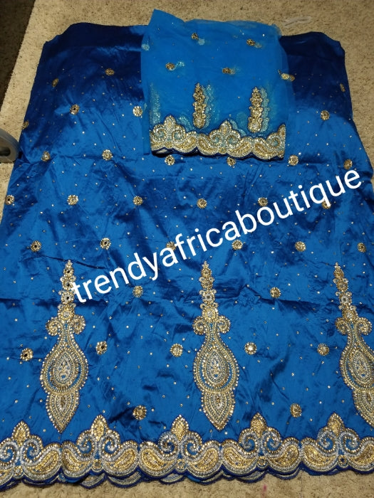 SALE,SALE- New arrival Nigerian Tranditional wedding George wrapper. Embellished with quality dazzling beads/crystal stones design in beautiful Turquoise blue. Full 5yds + 1.8yds matching blouse + free headtie. Indian-George.