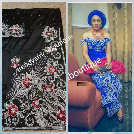 Special offer Nigerian Traditional wedding hand stoned silk George Wrapper and matching net blouse. Black with silver/red/gold crystal stones.  Beaded and stoned on the side border as well