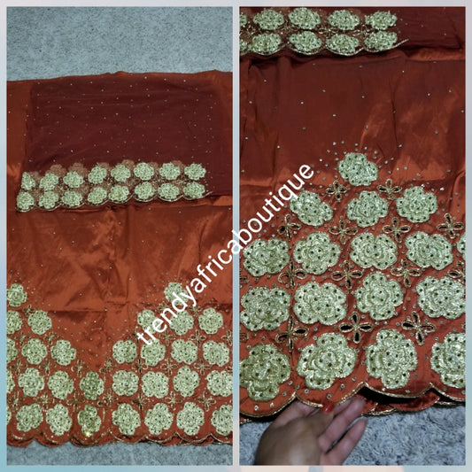 New arrival Burnt Orange/gold quality Silk George wrapper. Gold embriodery + all over crystal stone work. Classic design Niger/delta/igbo George design for Nigerian wedding and more. 5yds + 1.8yrds matching Blouse. Indian-george