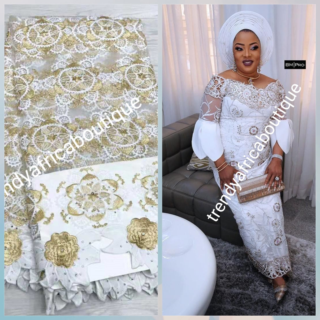 Latest design: African French lace fabric embellished with beads & stones all over to perfection. Sold per 5yds. Nigerian Bridal lace fabric white/gold. Model shown wearing similar fabric
