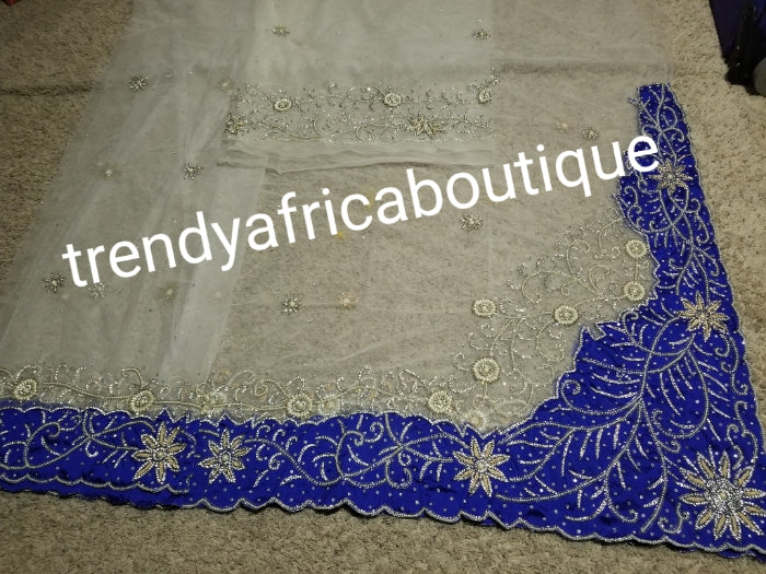 Latest Design: ready to ship White beaded and hand stoned Net/Royal blue taffeta combo on border and side. Gorgeous Igbo Traditional Bridal outfit- quality hand work to perfection. George wrapper and matchimg net blouse. 6.8yds total