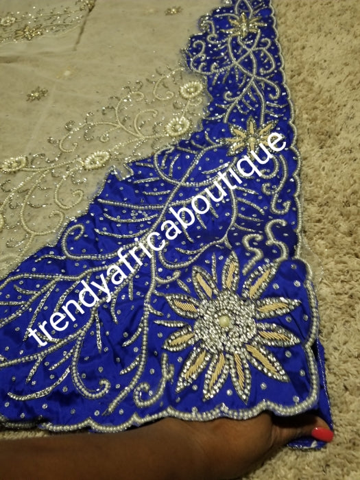 Latest Design: ready to ship White beaded and hand stoned Net/Royal blue taffeta combo on border and side. Gorgeous Igbo Traditional Bridal outfit- quality hand work to perfection. George wrapper and matchimg net blouse. 6.8yds total