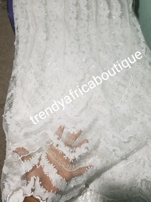 New arrival white/white net French lace fabric. Quality lace stoned with pearls and sequins. Sold per 5yds. African french lace fabric. Rich quality for wedding dress