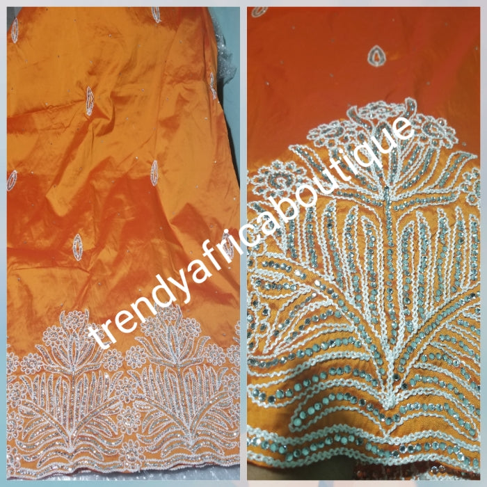 Original quality taffeta George wrapper. beautiful orange embriodery/crystal stones George Wrapper. dazzling crystal stones to perfection. Small-George. Model wearing similar George. Aso-ebi Georges