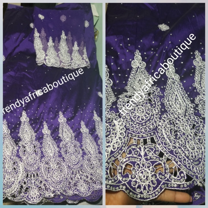 Original quality taffeta George wrapper. beautiful Purple embrioded and all over crystal stones Wrapper in 5yds + 1.8yds net for blouse. dazzling crystal stones to perfection. Small-George. Model wearing similar George. Use for Nigerian weddings and more