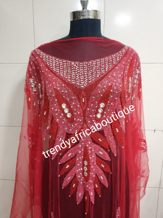 Red Heavily-beaded net for making blouses. Popularly use by Igbo/Delta/edo women for big Occasions. Comes in 1.8yds lenght already design for your beautiful blouse