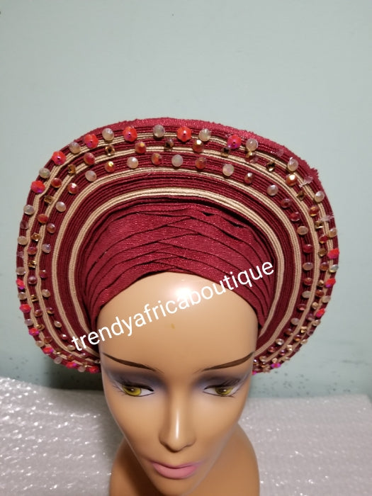 Wine/champagne aso-oke embellished with beads/stones auto-gele. Wahala free gele already made for you with finest quality aso-oke. Easy adjustment for proper fit at the back. Original quality from Nigeria.