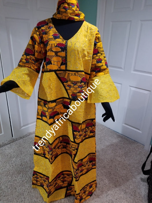 clearance:. Embriodered and stoned Ankara-dress, Long dress embellished with shinning multi color Swarovski stones to perfection! Fit Burst 48" and Full lenght 59", sleeve lenght 19.5. Made with Quality hitarget Ankara mix with dry lace. Flared sleeves