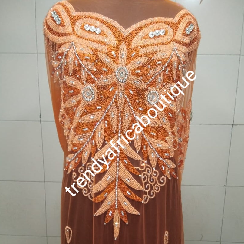 Orange color Heavily-beaded net for making blouses. Popularly use by Igbo/Delta/edo women for making modern big Occasion BlouseComes in 1.8yds lenght already design for your beautiful blouse