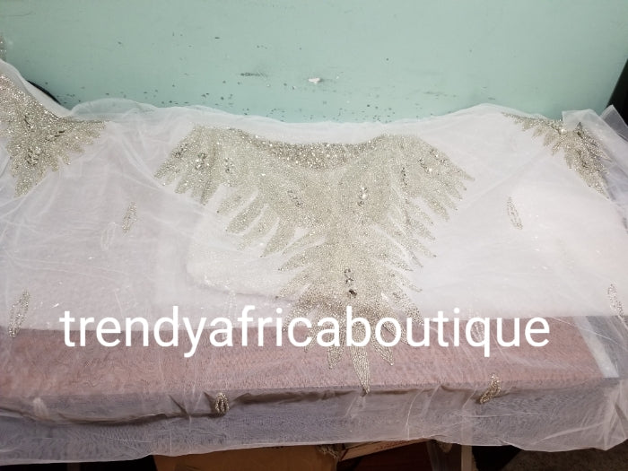 Pure white Heavily-beaded net for making modern blouses. Popularly use by Igbo/Delta/edo women for big Occasions. Comes in 1.8yds lenght already design for your beautiful blouse. 1.8yds × 55" width.