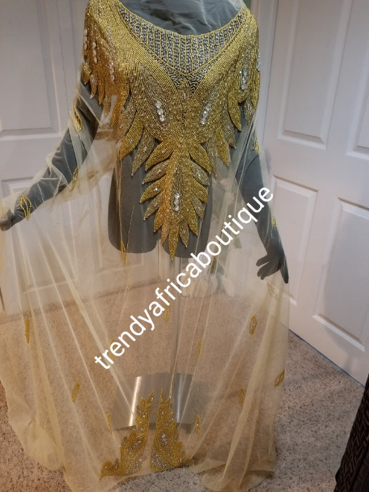 Champagne gold/gold Heavily-beaded net for making modern blouses. Popularly use by Igbo/Delta/edo women for big Occasions. Comes in 1.8yds lenght already design for your beautiful blouse. 1.8yds × 55" width.