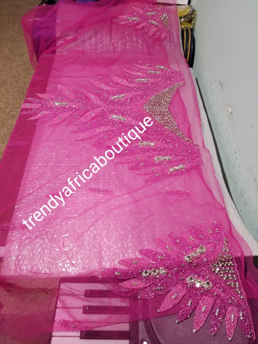 Fuschia pink Heavily-beaded net for making blouses. Popularly use by Igbo/Delta/edo women for big Occasions. Comes in 1.8yds lenght already design for your beautiful blouse