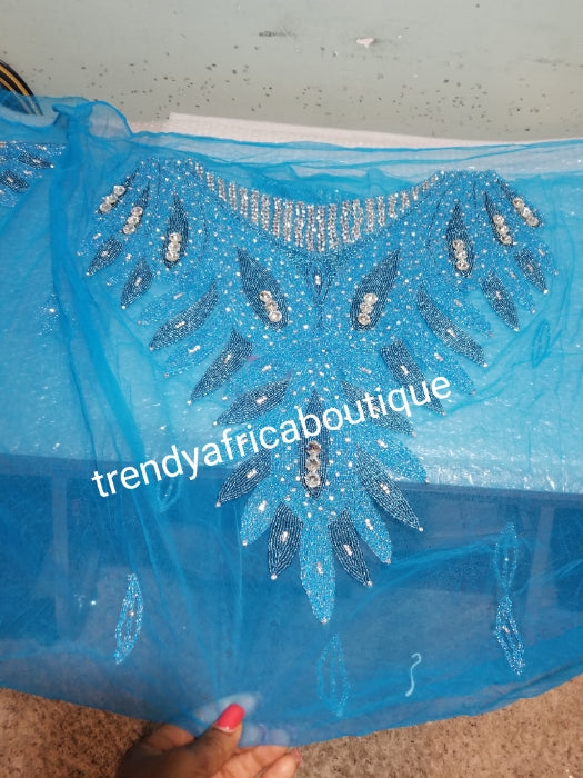Turquoise blue Heavily-beaded net for making blouses. Popularly use by Igbo/Delta/edo women for big Occasions. Comes in 1.8yds lenght already design for your beautiful blouse