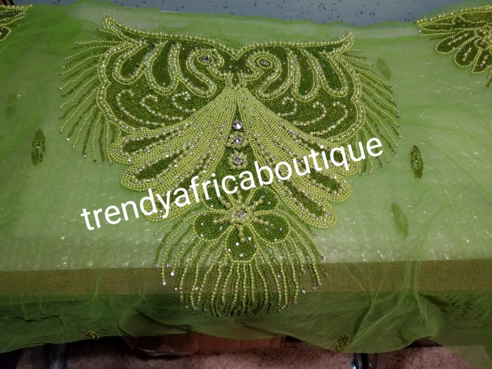 Lemon green Heavily-beaded net for making blouses. Popularly use by Igbo/Delta/edo women for big Occasions. Comes in 1.8yds lenght already design for your beautiful blouse