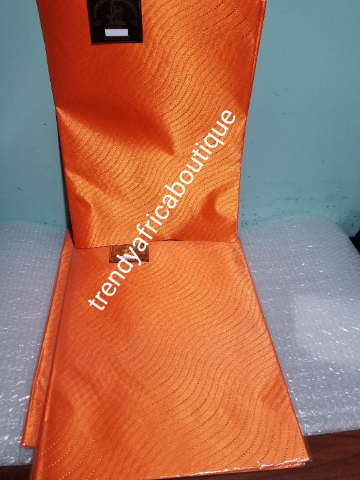 Orange 2 in 1 pack Sago gele head tie for Nigerian head wrap. Beautiful design. Soft texture, easy to tie into beautiful Nigerian party gele. Excellent quality. Sold as a park