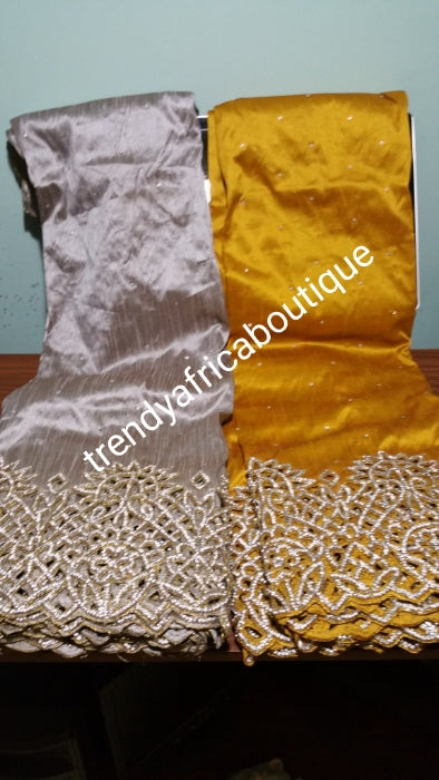 Clearance: Gold VIP handcut border George wrapper with crystal stones. Delta/Igbo women George wrapper with matching white blouse. Quality cut and stoned work. 5 full yards gold George wrapper not cut with 1.8yds white contract blouse