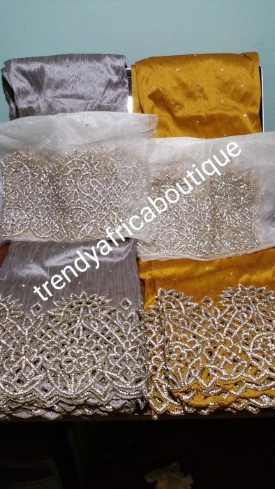 Clearance: Gold VIP handcut border George wrapper with crystal stones. Delta/Igbo women George wrapper with matching white blouse. Quality cut and stoned work. 5 full yards gold George wrapper not cut with 1.8yds white contract blouse