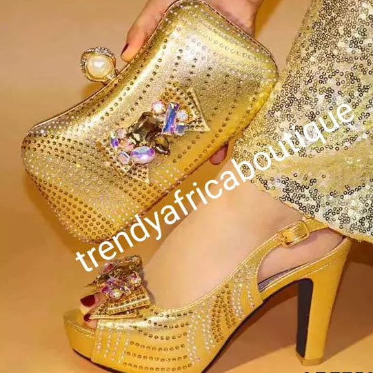Size 39 Gold high heel Italian matching platform shoe and hand clutch. Embellish with crystal stones Italian made shoe and bag. Sold as a set.  4" high heel shoe run big in size.