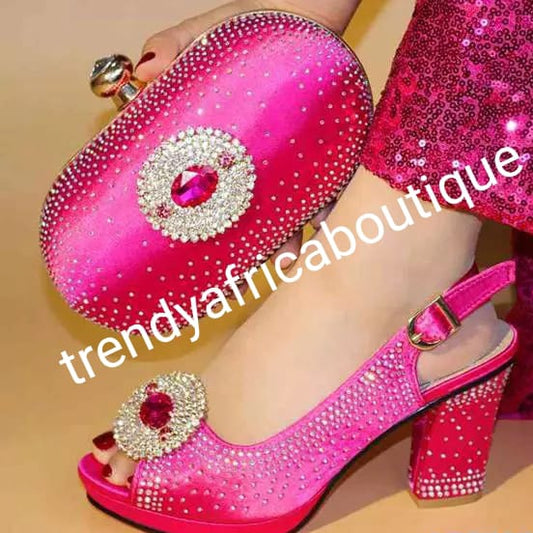 Clearance: only Size 39 and 40 fuschia pink Italian style matching platform shoe and hand clutch. Embellish with Quality  crystal stones on shoe and clutch. Italian made shoe and bag. Sold as a set. Shoe run big in size.heel is 3.5"
