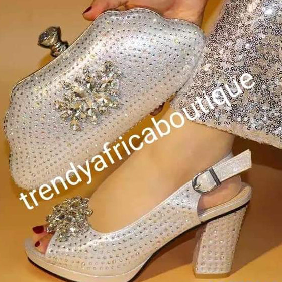 Available in Size 42 Silver Italian style matching platform shoe and hand clutch. Embellish with Quality crystal stones on shoe and clutch. Italian made shoe and bag. Sold as a set. Note shoe run big in size. Heel is 3.5"