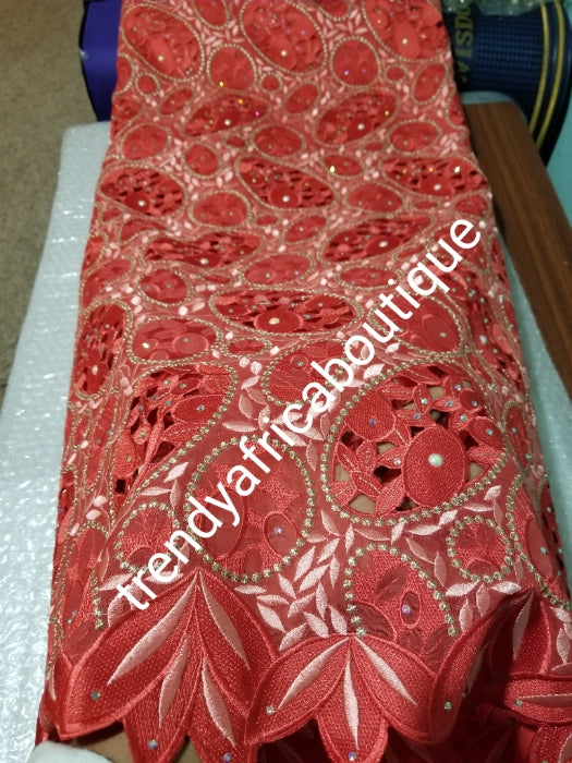 Exclusive swiss lace fabric in sweet coral/peach. Nigerian traditional celebrant Swiss lace embroidered, beaded and stoned, handcut soft beautiful design. Sold per 5yds