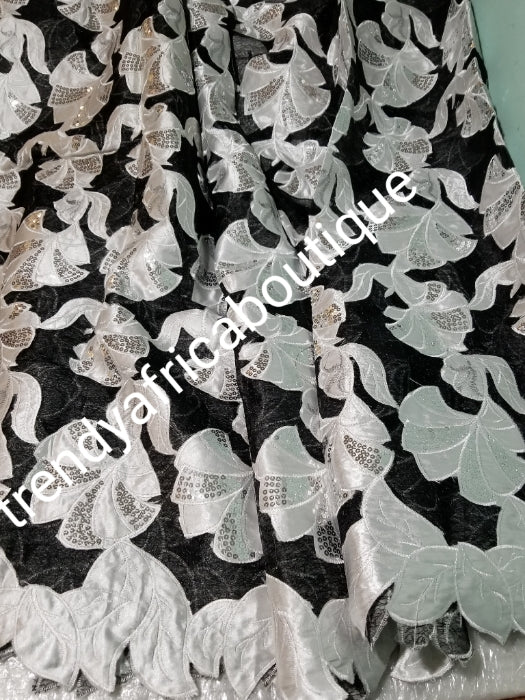 Clearance sale:  black/white French lace fabric. Quality white flowered patten embriodery work, all over dazzling silver sequence. Sold per 5yds. Price is for 5yds. Beautiful African embriodery french lace- swiss quality design