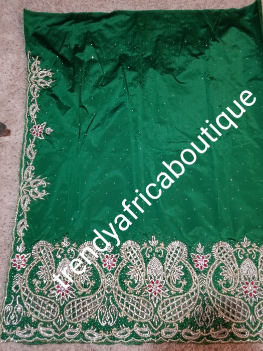 Special sale: Traditional weddings/celebrant super quality silk George wrapper. Green silk George + 2yds matching gold design net.  Beautiful hand cut design with beaded/Crystal stoned for that special occasion. Classic Igbo/delta wedding wrapper