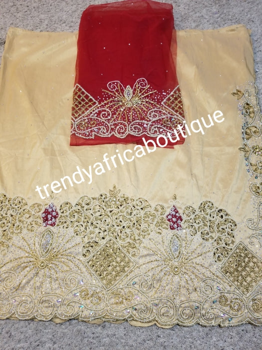 Ready to ship. Gold Celebrants VIP hand Stoned with dazzling Crystal stones George wrapper. Fully hand stone work design. 5yds + 1.8 yds matching net blouse. Gold wrapper/red blouse. Exclusive handcut design for Igbo/delta women