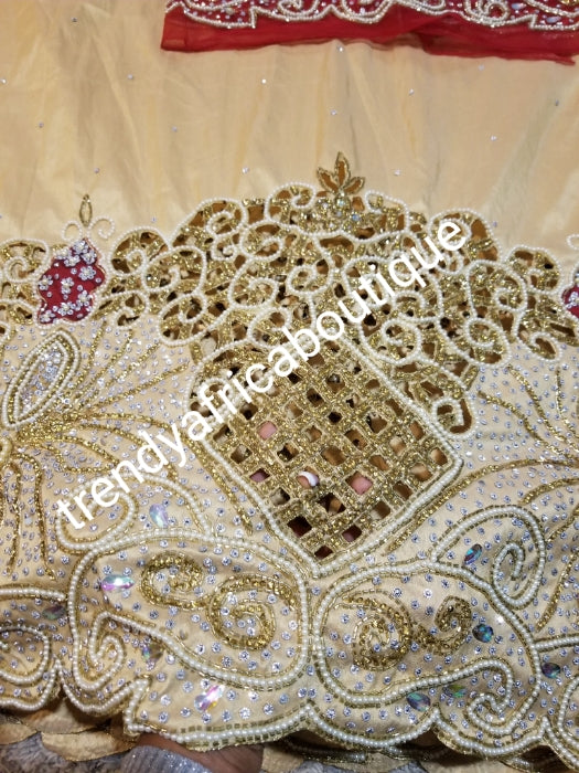 Ready to ship. Gold Celebrants VIP hand Stoned with dazzling Crystal stones George wrapper. Fully hand stone work design. 5yds + 1.8 yds matching net blouse. Gold wrapper/red blouse. Exclusive handcut design for Igbo/delta women