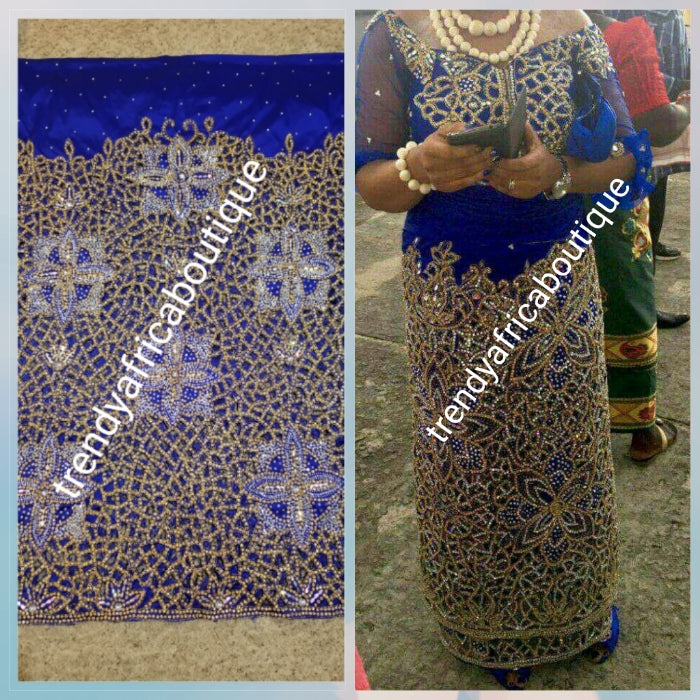 Back in stock, Royal blue handcut crystal stoned VIP Madam silk George. Igbo women traditional celebrant George wrapper  with blouse. 1.8yds net for blouse 2 wrapper ready for use.