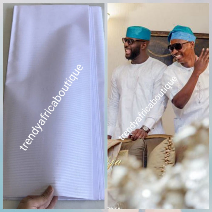 On Sale: Top quality pure white atiku swiss voile lace fabric for Nigerian Men native outfit. Soft quality fabric. Can be use for agbada/3pc outfit for men. Sold per 5yds. Price is for 5yds