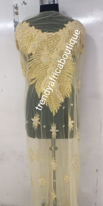 Back in stock Champagn/gold Heavily-beaded/crystal stones net George for making blouses. Popularly use by Igbo/Delta/edo women for big Occasions. Comes in 1.8yds lenght already design for your beautiful celebrant blouse