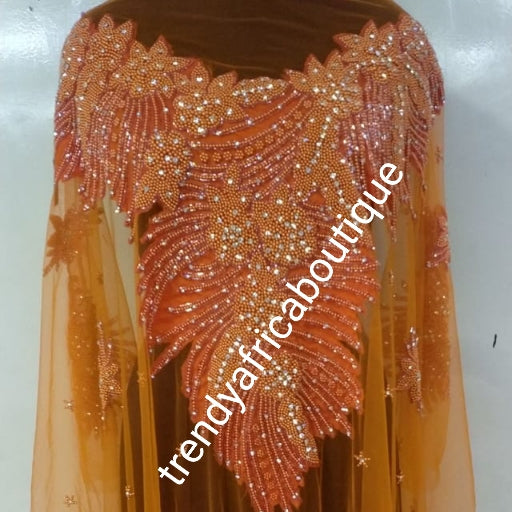 Back in stock: Orange Heavily-beaded/crystal stones net George for making blouses. Popularly use by Igbo/Delta/edo women for big events. Comes in 1.8yds lenght already design for your beautiful blouse