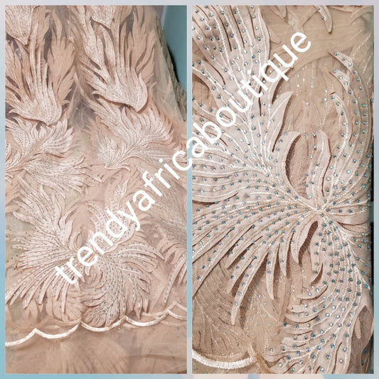 New arrival champagne gold French lace design. Swiss quality embellished with crystal stoned. Sold per 5yds. Nigerian french lace fabric. Rich quality for wedding dresses. For making Nigerian party dresses.