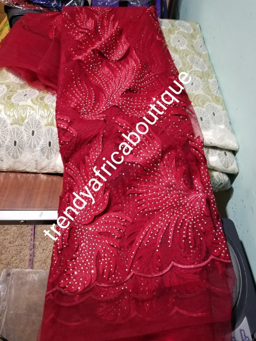 New arrival tomato Red classic French lace design. Swiss quality embellished with crystal stoned. Sold per 5yds. Nigerian french lace fabric. Rich quality for wedding dresses. For making Nigerian party dresses.