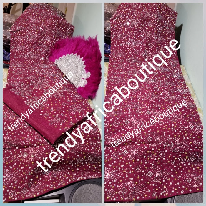 Bonus Offer magenta bedazzled Aso-oke. 4pc wide Gele with 72" long Ipele (shoulder shawl). Sold with or without feather fan. Nigerian Celebrant Aso-oke with matching  fila & feather fan from Nigeria. All over Swarovski stone work on gele/ipele