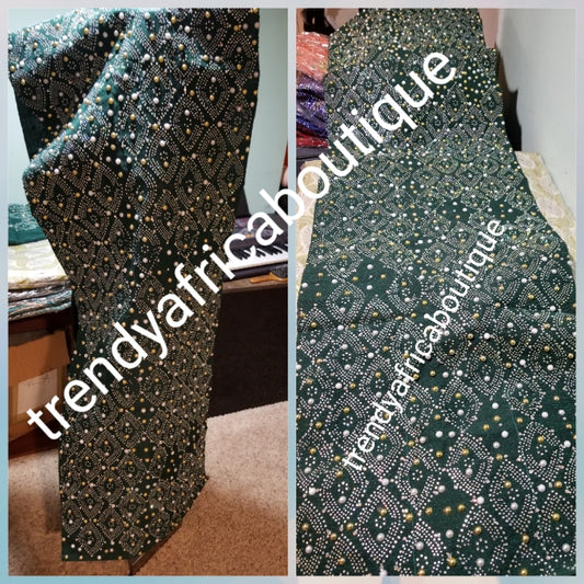 Bonus offer emerald green bedazzled Aso-oke. 4pc wide Gele with 72" long Ipele (shoulder shawl). Sold with or without feather fan. Aso-oke with matching  fila  and feather fan. All over Swarovski stone work on gele/ipele. Quality Celebrant aso-oke