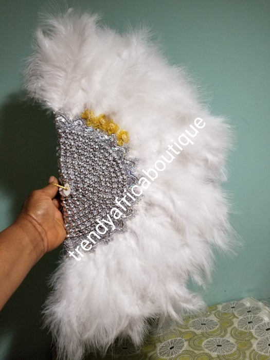 New arrival White/silver fluffy Feather hand fan. Medium size moon shape hand fan Nigerian Bridal-accessories front and back design with beads and flower petal. Limited quantity. Very classy. 22" long× 12" wide