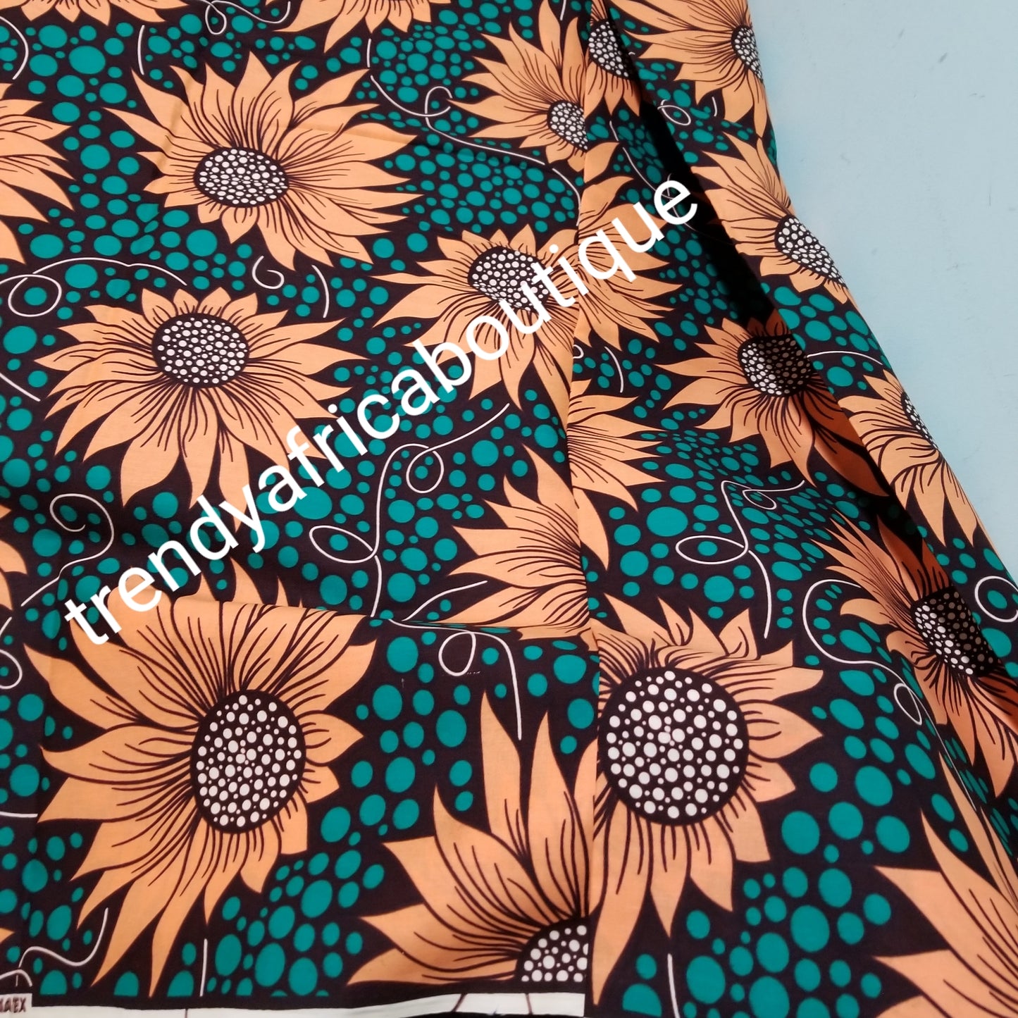 Teal green/peach 100% veritable cotton Ankara wax print fabric. Sold per 6yds. Price is for 6yds. Soft texture. Excellent quality for making fabulous African outfit