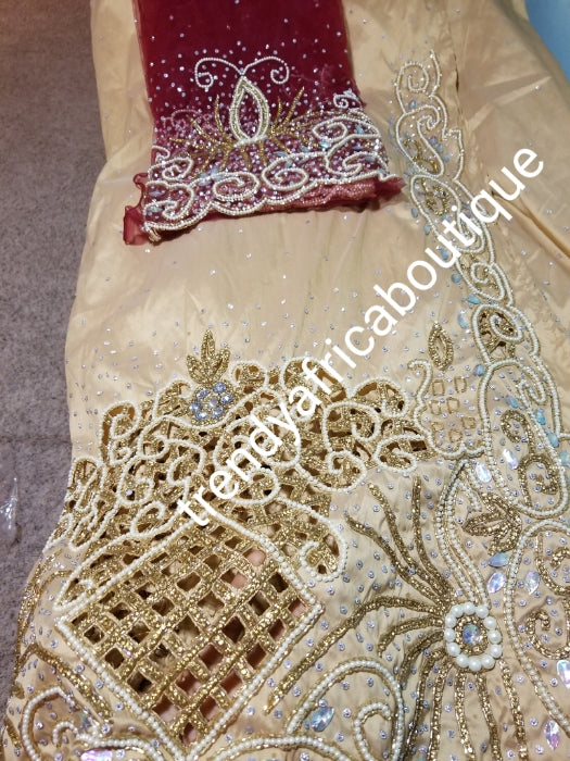 Special Offer: Ready to ship. Champagne Gold/Wine Blouse Celebrants VIP hand Stoned with dazzling Crystal stones George wrapper. 2.5yds + 2.5yds + 1.8 yds matching net blouse. Exclusive handcut design for Igbo/delta women or men outfit