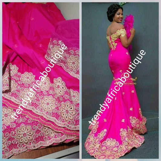 Sale: New arrival Nigerian Tranditional wedding George wrapper. Embellished with quality dazzling beads/crystal stones. Classic fuschia pink. Full 5yds + 1.8yds matching blouse + free headtie. Indian-George. Model shown wearing similar fabric