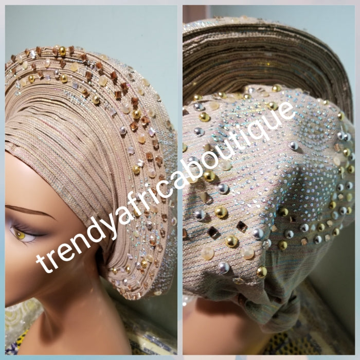 Quality champagne gold Auto-gele made with quality Aso-oke. Beaded and stoned work front and back to perfection.  One size fit, easy to adjust for fit and knot at the back to secure your gele. This is true original auto gele