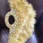New arrival Pure Gold  feather hand fan. Large moon shape with handle. Nigerian  Bridal-accessories flower brooch front design. Embellished with sparkling crystal stones.. 25" long + 14" wide. Small handle to hold your fan.