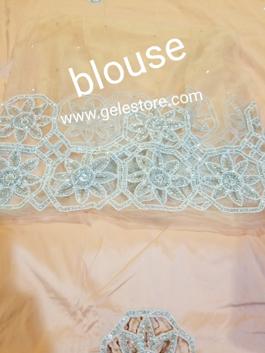 Ready to ship: Peach/peach blouse Quality taffeta Silk George wrapper embellished with dazzling Crystals and beaded to perfection for IIgbo/Niger/Delta women Red carpet events. Sold as 2 wrapper + 1.8yds Net for blouse. You will love the quality!