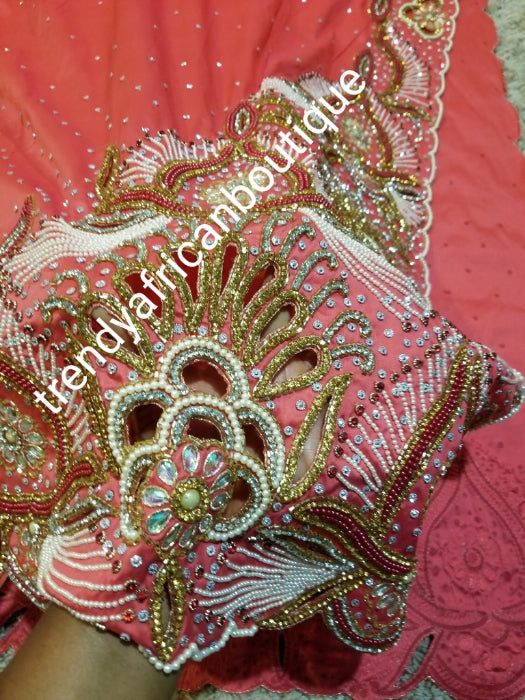 Special offer: coral pink first Lady/VIP hand beaded and stoned Nigerian traditional Celebrant George with matching blouse. Niger/Delta/Igbo women Georges. Exclusive Side beaded design wrapper, Sold as a set of 2 wrapper +1.8yds matching net for blouse