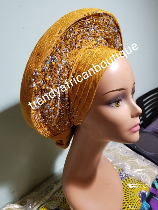 Clearance: Beaded and stoned Gold Auto-gele made with quality Aso-oke. Beaded and stoned work front and back to perfection.  One size fit, easy to adjust  and knot at the back to secure your gele. This is true original auto gele
