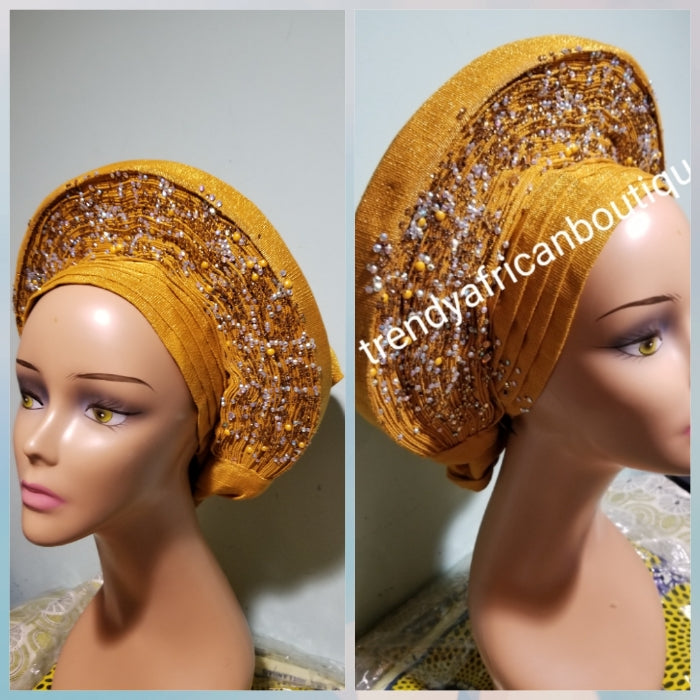 Clearance: Beaded and stoned Gold Auto-gele made with quality Aso-oke. Beaded and stoned work front and back to perfection.  One size fit, easy to adjust  and knot at the back to secure your gele. This is true original auto gele