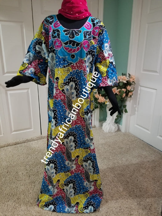 Embriodered and stoned multi color Ankara-dress, embellished with shinning Swarovski stones to perfection! Fit Burst 46" and Full lenght 60" lenght shoulder to floor. Made with Quality Ankara/stoned work. Comes with a matching headtie. Flared sleeves