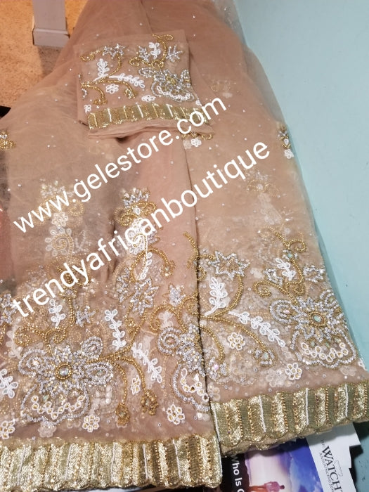 Ready to ship. Classic champagne gold net George. perfect stone work for traditional Bridal outfit. Quality beaded and dazzling crystal stoned on a  net George wrapper. 2.5yds + 2.5yds + 2yds.fabric. Sold as a set, price is for a set.