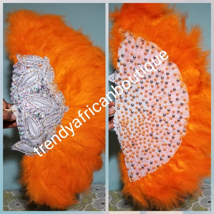 Clearance Orange Feather hand fan. Medium front and back design moon shape hand fan Nigerian  Bridal-accessories front and back  design with gold beads and flower petal. Limited quantity. 19" long + 14" wide. Small handle to hold your fan. Very classy
